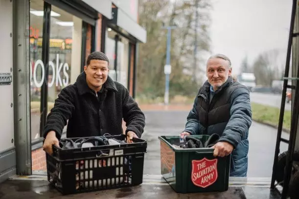 two salvation army volunteers working together 