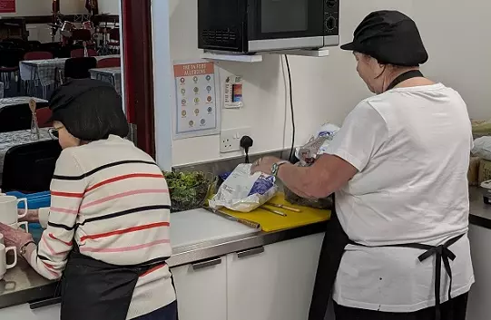 Two Volunteers working at the Salvation Army Kitchen in Cwmbran